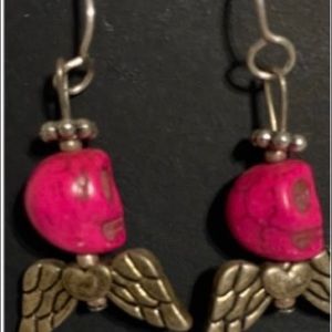 Skull earrings reddish color